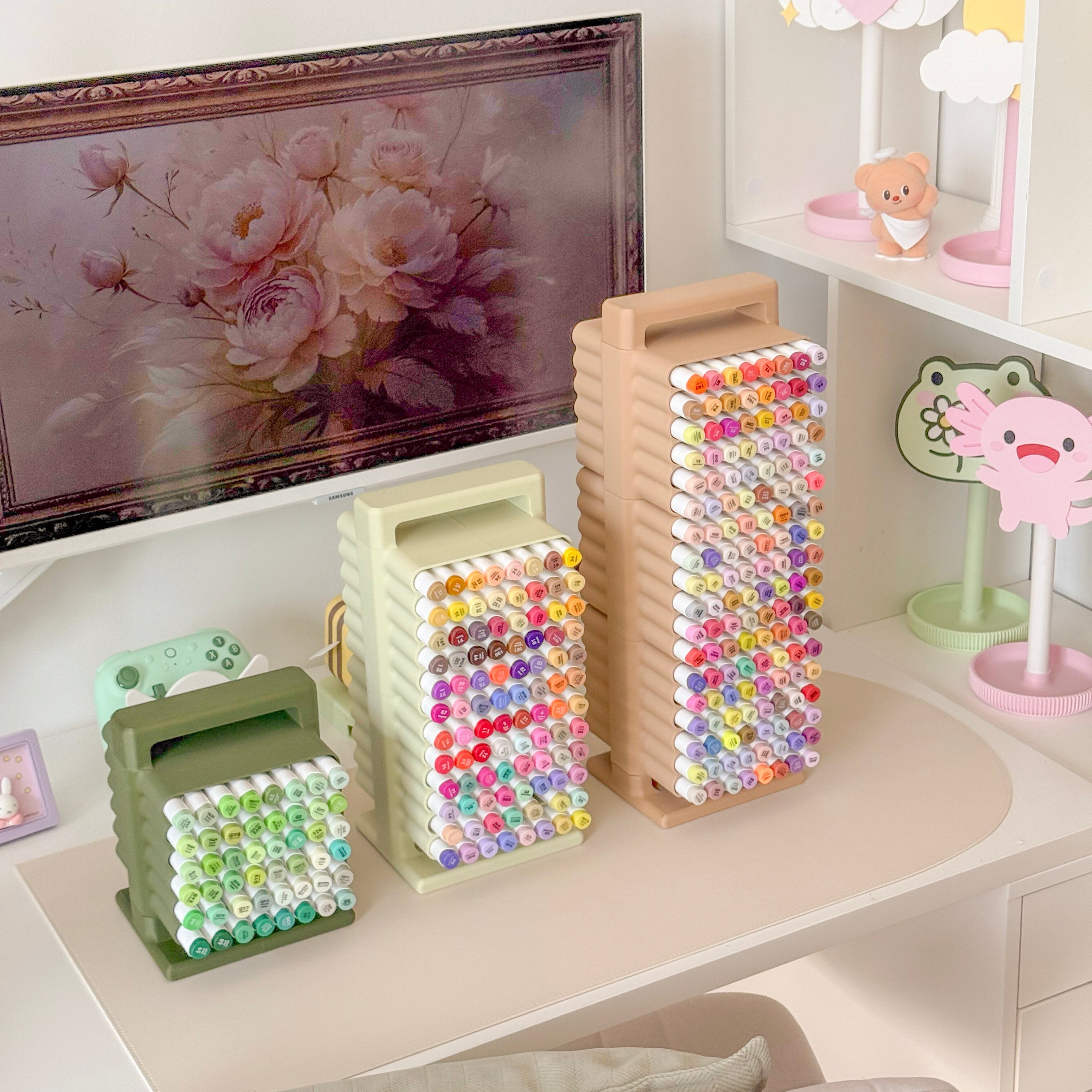Colorful beaded containers on a shelf with decorative items in the background